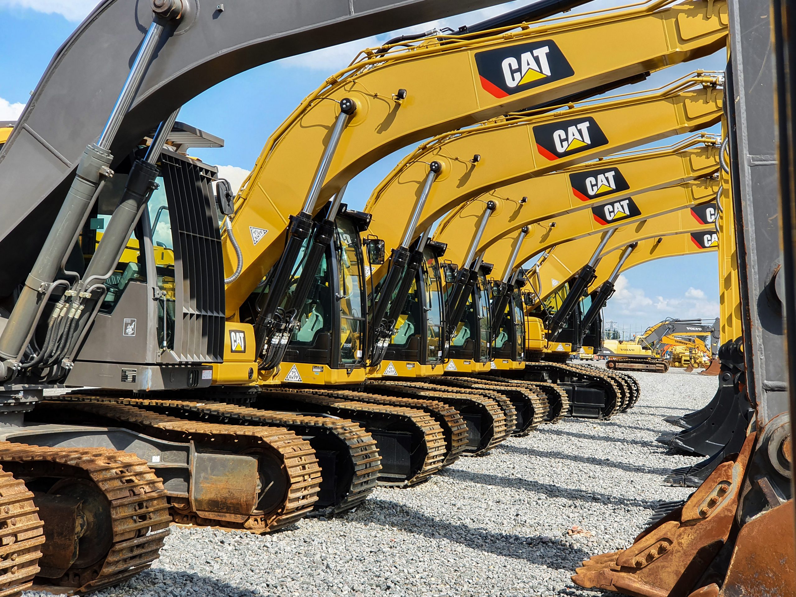 A line of CAT excavators.