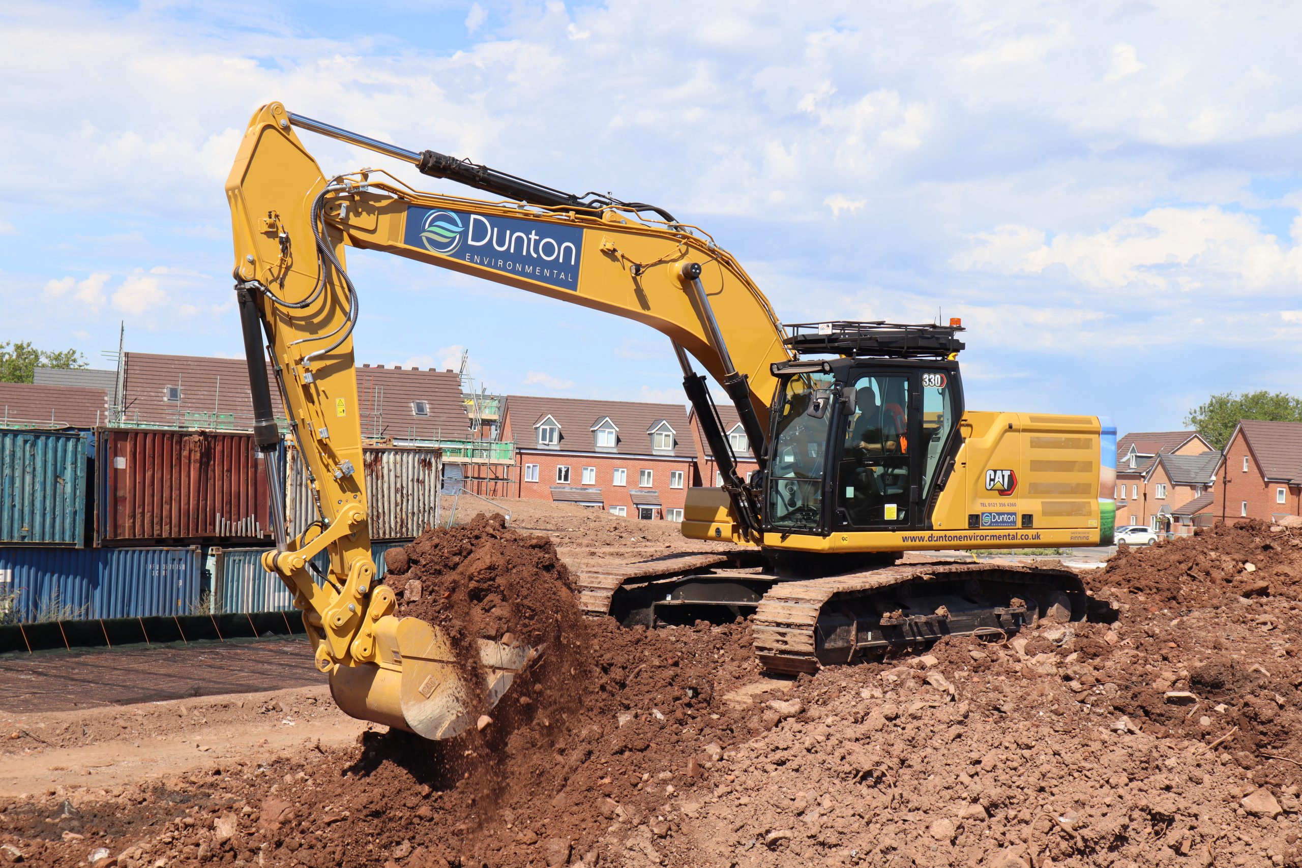 A CAT 330 hydraulic excavator at the construction site.