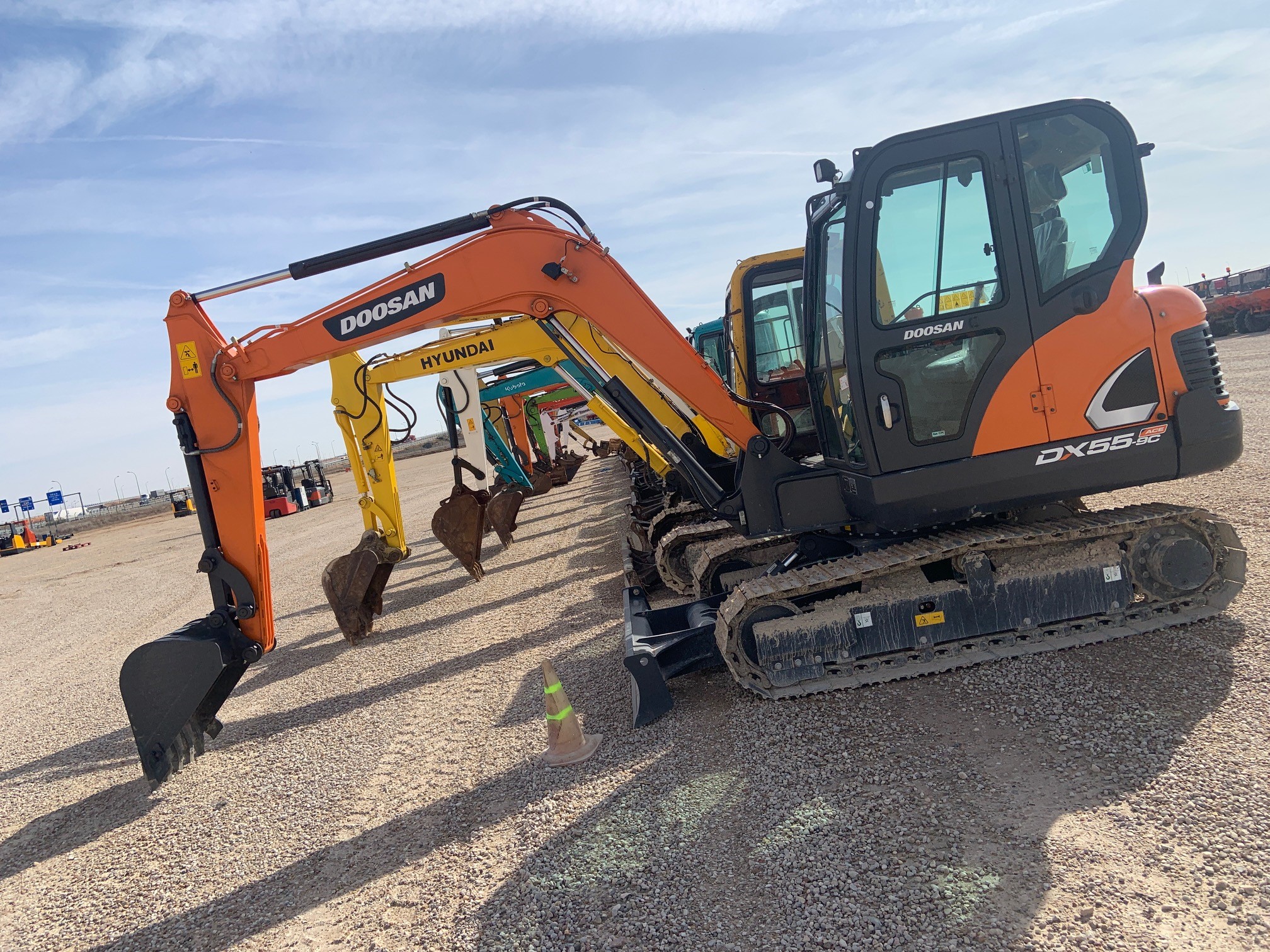 Compact excavators parked side by side.