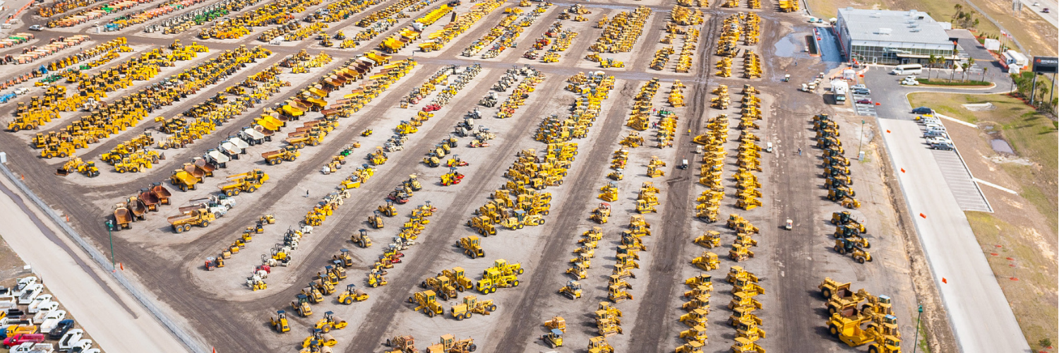 An aerial view of the heavy equipment parked in the auction yard.