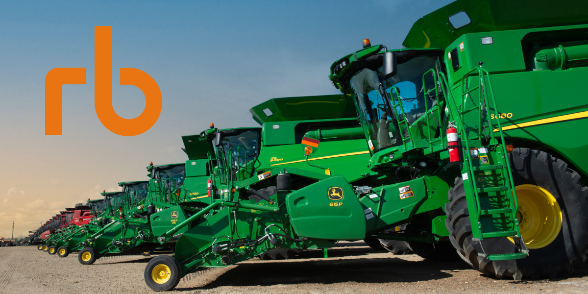 A display of several John Deere combine harvesters