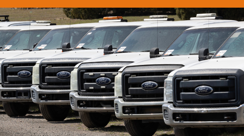 Ford 5-250 Super Duty Pick trucks parked side by side.