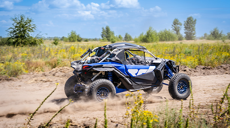 A utility terrain vehicle is on the move.