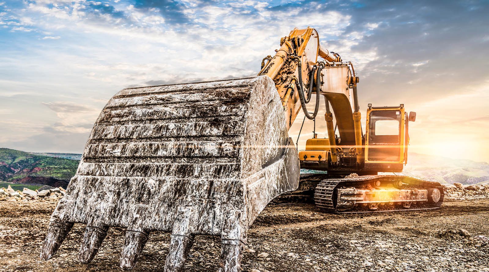 A portrait of a large excavator with a massive bucket