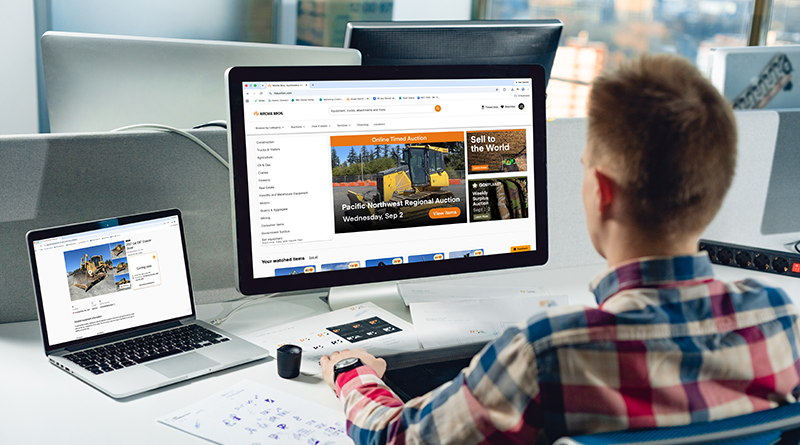 Buyer reviewing Ritchie Bros. account dashboard on desktop and laptop screens